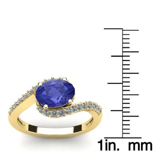 1 1/2 Carat Oval Shape Tanzanite and Halo Diamond Ring In 14 Karat Yellow Gold
