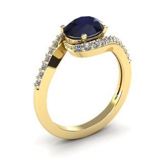 1 3/4 Carat Oval Shape Sapphire and Halo Diamond Ring In 14 Karat Yellow Gold