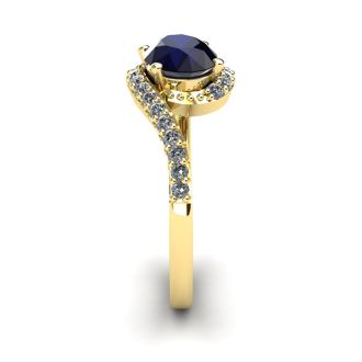 1 3/4 Carat Oval Shape Sapphire and Halo Diamond Ring In 14 Karat Yellow Gold