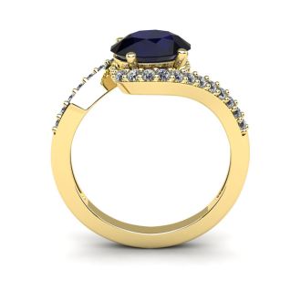 1 3/4 Carat Oval Shape Sapphire and Halo Diamond Ring In 14 Karat Yellow Gold