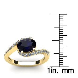 1 3/4 Carat Oval Shape Sapphire and Halo Diamond Ring In 14 Karat Yellow Gold