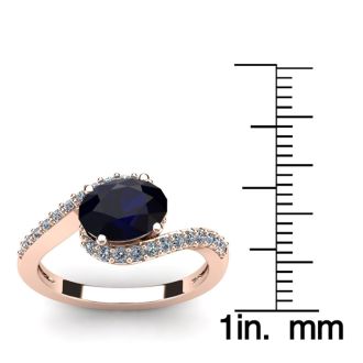 1 3/4 Carat Oval Shape Sapphire and Halo Diamond Ring In 14 Karat Rose Gold