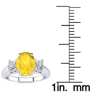 1 1/4 Carat Oval Shape Citrine and Two Diamond Ring In 14 Karat White Gold
