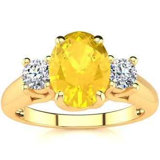 1 1/4 Carat Oval Shape Citrine and Two Diamond Ring In 14 Karat Yellow Gold