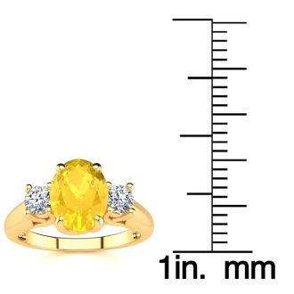 1 1/4 Carat Oval Shape Citrine and Two Diamond Ring In 14 Karat Yellow Gold