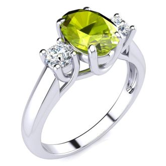 1 1/2 Carat Oval Shape Peridot and Two Diamond Ring In 14 Karat White Gold
