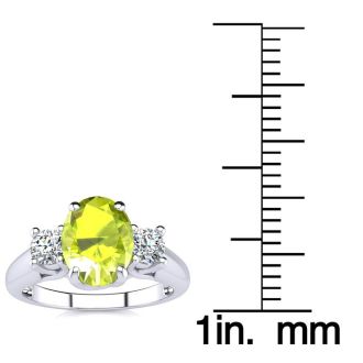 1 1/2 Carat Oval Shape Peridot and Two Diamond Ring In 14 Karat White Gold