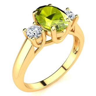1 1/2 Carat Oval Shape Peridot and Two Diamond Ring In 14 Karat Yellow Gold