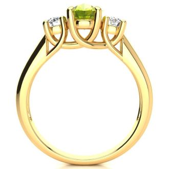 1 1/2 Carat Oval Shape Peridot and Two Diamond Ring In 14 Karat Yellow Gold