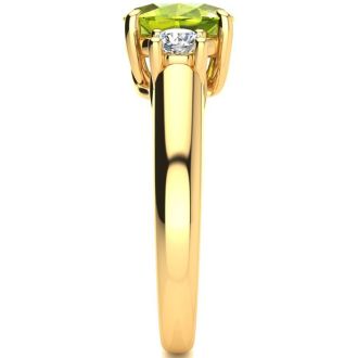 1 1/2 Carat Oval Shape Peridot and Two Diamond Ring In 14 Karat Yellow Gold