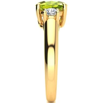 1 1/2 Carat Oval Shape Peridot and Two Diamond Ring In 14 Karat Yellow Gold