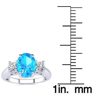 1 3/4 Carat Oval Shape Blue Topaz and Two Diamond Ring In 14 Karat White Gold