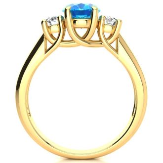 1 3/4 Carat Oval Shape Blue Topaz and Two Diamond Ring In 14 Karat Yellow Gold