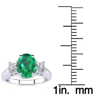 1 1/3 Carat Oval Shape Emerald and Two Diamond Ring In 14 Karat White Gold