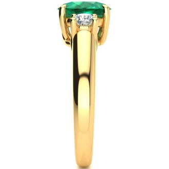 1 1/3 Carat Oval Shape Emerald and Two Diamond Ring In 14 Karat Yellow Gold