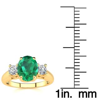 1 1/3 Carat Oval Shape Emerald and Two Diamond Ring In 14 Karat Yellow Gold
