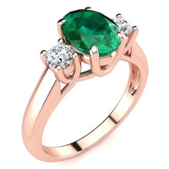 1 1/3 Carat Oval Shape Emerald and Two Diamond Ring In 14 Karat Rose Gold