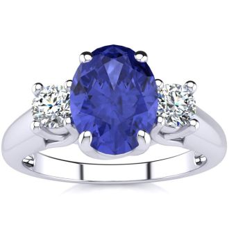 1 1/2 Carat Oval Shape Tanzanite and Two Diamond Ring In 14 Karat White Gold