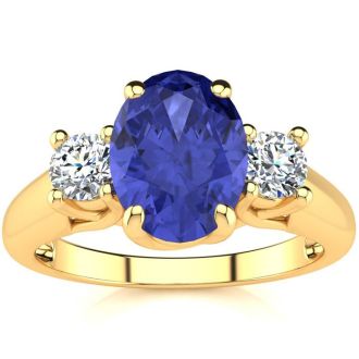 1 1/2 Carat Oval Shape Tanzanite and Two Diamond Ring In 14 Karat Yellow Gold