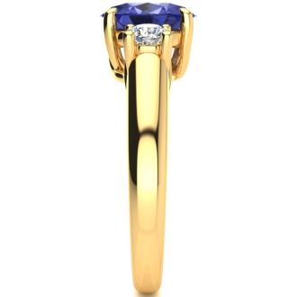 1 1/2 Carat Oval Shape Tanzanite and Two Diamond Ring In 14 Karat Yellow Gold