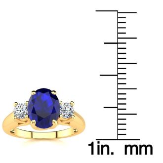 1 1/2 Carat Oval Shape Tanzanite and Two Diamond Ring In 14 Karat Yellow Gold