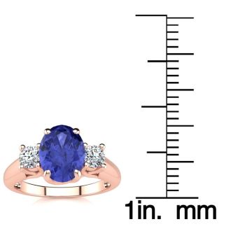 1 1/2 Carat Oval Shape Tanzanite and Two Diamond Ring In 14 Karat Rose Gold