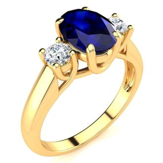 1 3/4 Carat Oval Shape Sapphire and Two Diamond Ring In 14 Karat Yellow Gold