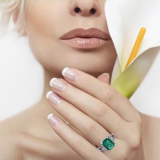 4 Carat Emerald and Halo Diamond Ring In 14 Karat White Gold
