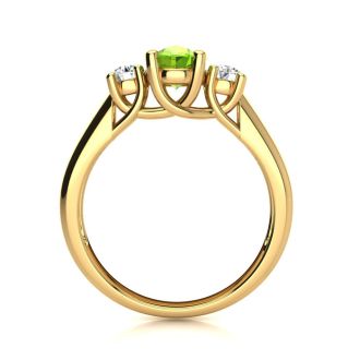 1 Carat Oval Shape Peridot and Two Diamond Ring In 14 Karat Yellow Gold