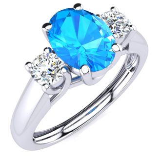 1 1/5 Carat Oval Shape Blue Topaz and Two Diamond Ring In 14 Karat White Gold
