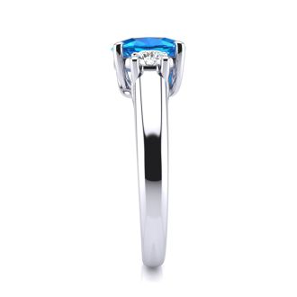 1 1/5 Carat Oval Shape Blue Topaz and Two Diamond Ring In 14 Karat White Gold
