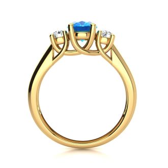 1 1/5 Carat Oval Shape Blue Topaz and Two Diamond Ring In 14 Karat Yellow Gold
