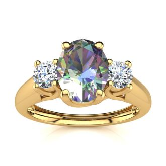 1 1/5 Carat Oval Shape Mystic Topaz and Two Diamond Ring In 14 Karat Yellow Gold
