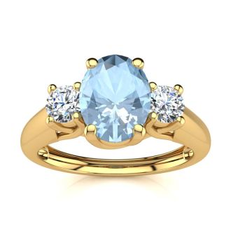 Aquamarine Ring: Aquamarine Jewelry: 1 Carat Oval Shape Aquamarine and Two Diamond Ring In 14 Karat Yellow Gold
