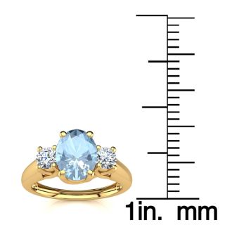 Aquamarine Ring: Aquamarine Jewelry: 1 Carat Oval Shape Aquamarine and Two Diamond Ring In 14 Karat Yellow Gold
