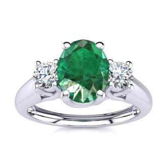 1 Carat Oval Shape Emerald and Two Diamond Ring In 14 Karat White Gold