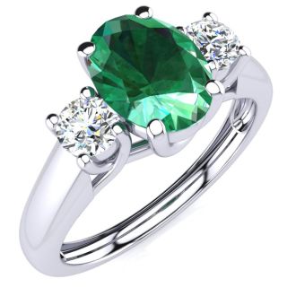 1 Carat Oval Shape Emerald and Two Diamond Ring In 14 Karat White Gold