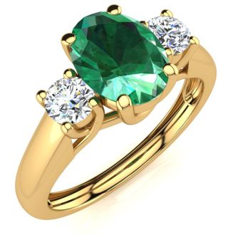1 Carat Oval Shape Emerald and Two Diamond Ring In 14 Karat Yellow Gold