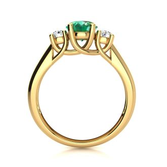 1 Carat Oval Shape Emerald and Two Diamond Ring In 14 Karat Yellow Gold