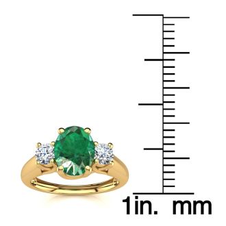 1 Carat Oval Shape Emerald and Two Diamond Ring In 14 Karat Yellow Gold