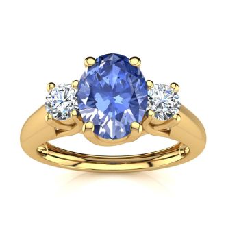 1.15 Carat Oval Shape Tanzanite and Two Diamond Ring In 14 Karat Yellow Gold