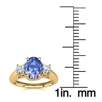 1.15 Carat Oval Shape Tanzanite and Two Diamond Ring In 14 Karat Yellow Gold