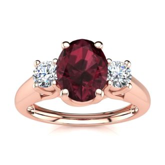 Garnet Ring: Garnet Jewelry: 1 1/5 Carat Oval Shape Garnet and Two Diamond Ring In 14 Karat Rose Gold