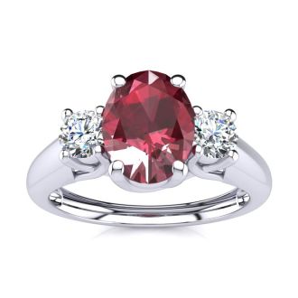 1.15 Carat Oval Shape Ruby and Two Diamond Ring In 14 Karat White Gold
