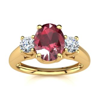 1.15 Carat Oval Shape Ruby and Two Diamond Ring In 14 Karat Yellow Gold