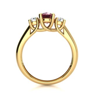 1.15 Carat Oval Shape Ruby and Two Diamond Ring In 14 Karat Yellow Gold