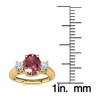 1.15 Carat Oval Shape Ruby and Two Diamond Ring In 14 Karat Yellow Gold