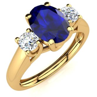1 1/5 Carat Oval Shape Sapphire and Two Diamond Ring In 14 Karat Yellow Gold