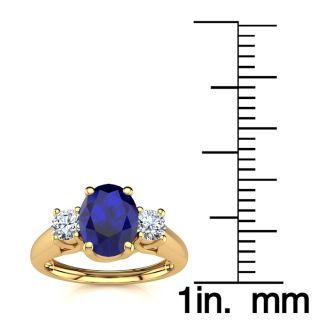 1 1/5 Carat Oval Shape Sapphire and Two Diamond Ring In 14 Karat Yellow Gold