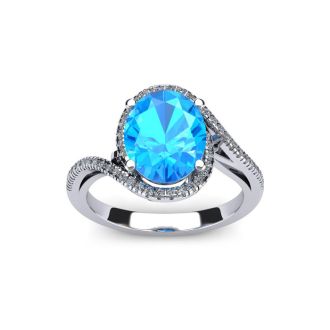 1 1/4 Carat Oval Shape Blue Topaz and Halo Diamond Ring In 14 Karat White Gold